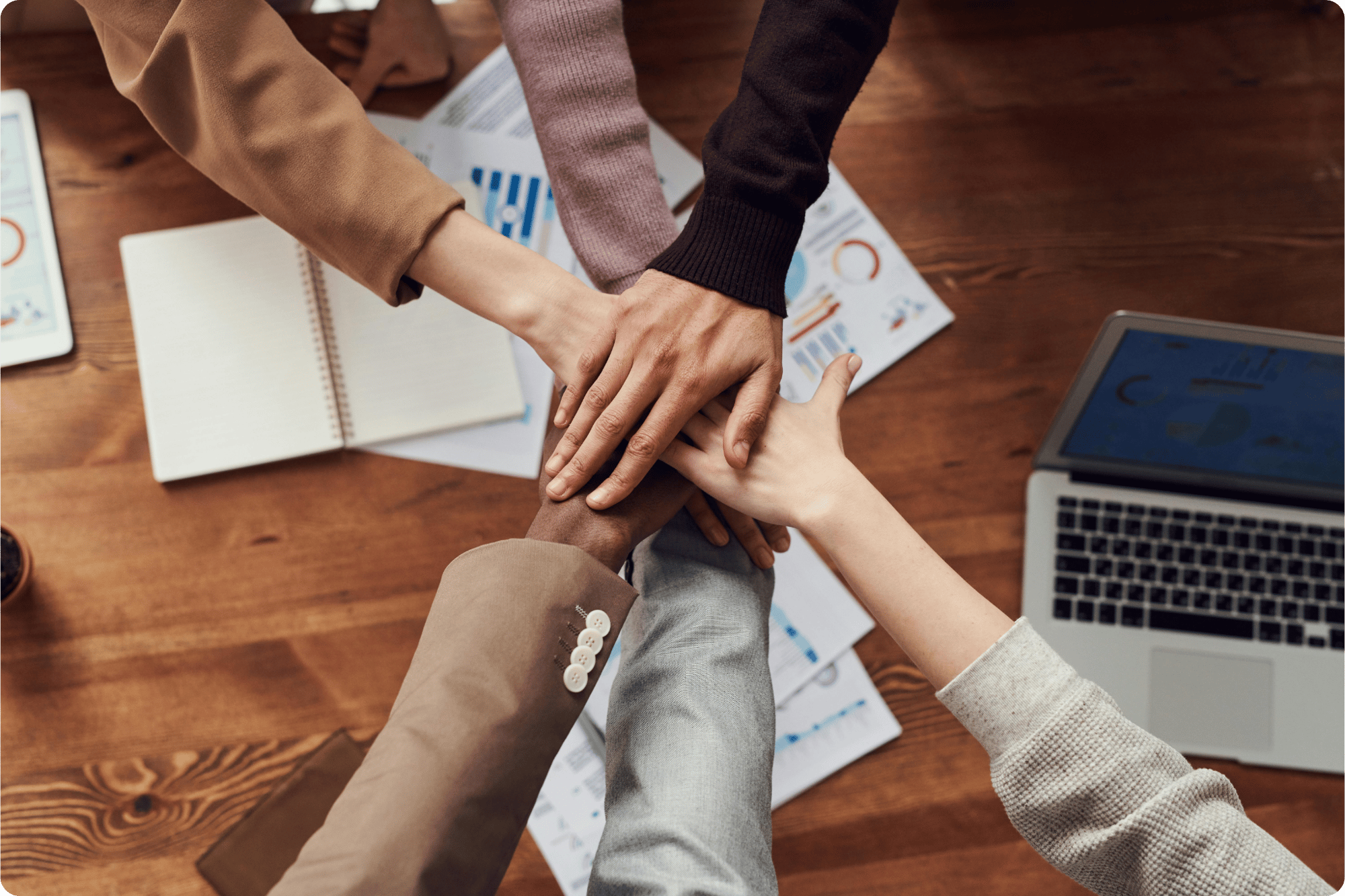 Homepage Image Group of Hands showing support and teamwork